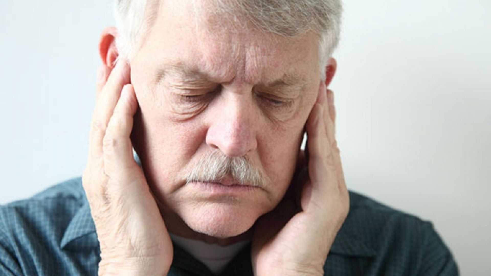 Older man with a neck pain